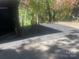 Asphalt parking area with protective wheel stops at 144 Hickory Hollow Ln, Taylorsville, NC 28681