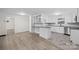 Modern kitchen with white cabinets, granite countertops, and stainless steel appliances at 144 Hickory Hollow Ln, Taylorsville, NC 28681