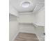 Spacious basement closet with built-in shelves at 144 Hickory Hollow Ln, Taylorsville, NC 28681