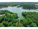 Aerial view of lakefront property with a cove and lush green trees at 144 Hickory Hollow Ln, Taylorsville, NC 28681