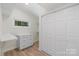 Spacious walk-in closet with built-in shelving and drawers at 144 Hickory Hollow Ln, Taylorsville, NC 28681