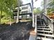 Modern lakefront home with expansive decks and stairs at 144 Hickory Hollow Ln, Taylorsville, NC 28681