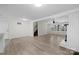 Open dining area with wood-look floors and view into the living room at 144 Hickory Hollow Ln, Taylorsville, NC 28681