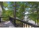 Lakefront deck with wooden railing and scenic view at 144 Hickory Hollow Ln, Taylorsville, NC 28681