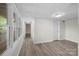 Finished basement hallway with vinyl flooring and access to other rooms at 144 Hickory Hollow Ln, Taylorsville, NC 28681