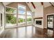 Living area with vaulted ceiling, fireplace, and lake view at 116 Emmaline Ct, Troutman, NC 28166