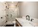 Modern bathroom with marble shower and quartz vanity at 116 Emmaline Ct, Troutman, NC 28166