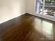 Bright bedroom with hardwood floors and a large window at 1913 Herrin Ave, Charlotte, NC 28205