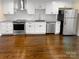 Modern kitchen with white shaker cabinets and granite countertops at 1913 Herrin Ave, Charlotte, NC 28205