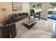Virtually staged living room featuring modern furniture and large windows at 1913 Herrin Ave, Charlotte, NC 28205