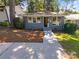 Gray brick house with a walkway and well-maintained lawn at 1913 Herrin Ave, Charlotte, NC 28205