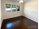 Spacious bedroom with hardwood floors and large windows at 1913 Herrin Ave, Charlotte, NC 28205