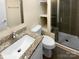 Updated bathroom with granite vanity and a shower/tub combo at 1913 Herrin Ave, Charlotte, NC 28205