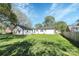 Large backyard offering ample space, partially visible neighboring houses, and a detached garage at 508 Northern St, Shelby, NC 28150