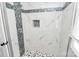 Walk-in shower with marble tile and mosaic accents at 508 Northern St, Shelby, NC 28150