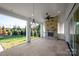 Outdoor patio with fireplace, ceiling fan, and chandelier; perfect for entertaining at 5723 Heirloom Crossing Ct, Charlotte, NC 28270