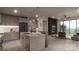 Modern kitchen with island and open living area at 9901 Benfield Rd # 314, Charlotte, NC 28269