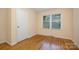 Simple bedroom with hardwood floors and a closet at 805 Rowan Avenue Ext, Spencer, NC 28159