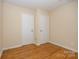 Bedroom with hardwood floors and double closets at 805 Rowan Avenue Ext, Spencer, NC 28159