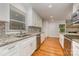 Updated kitchen with granite countertops, stainless steel appliances, and white cabinets at 805 Rowan Avenue Ext, Spencer, NC 28159
