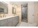 Updated bathroom with double vanity and a walk-in shower at 805 Rowan Avenue Ext, Spencer, NC 28159