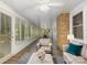 Bright sunroom with hardwood floors and access to the outdoors at 805 Rowan Avenue Ext, Spencer, NC 28159