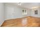 Dining room with hardwood floors, chandelier, and kitchen access at 805 Rowan Avenue Ext, Spencer, NC 28159