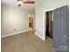 Bright bedroom with carpet, ceiling fan and large closet at 210 Harbour Place Dr, Davidson, NC 28036