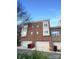 Brick townhouse exterior with two-car garage and landscaping at 210 Harbour Place Dr, Davidson, NC 28036