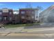 Brick front exterior of townhome with landscaping and street view at 210 Harbour Place Dr, Davidson, NC 28036