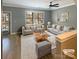 Virtually staged living room with neutral colored furniture and hardwood floors at 210 Harbour Place Dr, Davidson, NC 28036