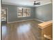 Spacious living room with hardwood floors and access to the front door at 210 Harbour Place Dr, Davidson, NC 28036
