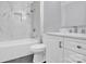 Modern bathroom with marble shower, soaking tub, and white vanity at 8433 Rittenhouse Cir, Charlotte, NC 28270