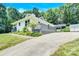 House exterior with driveway and landscaped yard at 8433 Rittenhouse Cir, Charlotte, NC 28270