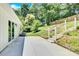 Spacious backyard patio, perfect for outdoor entertaining, adjacent to the house and wooded area at 8433 Rittenhouse Cir, Charlotte, NC 28270