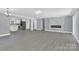Spacious living room, featuring a marble fireplace and open floor plan at 8433 Rittenhouse Cir, Charlotte, NC 28270