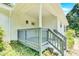 Charming front porch with gray railings and white exterior at 8433 Rittenhouse Cir, Charlotte, NC 28270