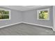 Bright bedroom with grey walls and laminate flooring at 8433 Rittenhouse Cir, Charlotte, NC 28270