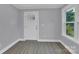 Bright entryway with hardwood floors and a white door at 8433 Rittenhouse Cir, Charlotte, NC 28270