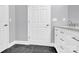 Bathroom with dark grey floor and white vanity at 8433 Rittenhouse Cir, Charlotte, NC 28270