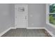Bright entryway with hardwood floors and a white door at 8433 Rittenhouse Cir, Charlotte, NC 28270
