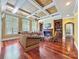 Spacious living room with hardwood floors, fireplace, and built-in shelving at 9100 Woodhall Lake Dr, Waxhaw, NC 28173