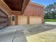 Three-car garage with extra storage space and gated entry at 9100 Woodhall Lake Dr, Waxhaw, NC 28173