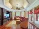 Comfortable Gathering room featuring a curved sofa and access to outdoor patio at 9100 Woodhall Lake Dr, Waxhaw, NC 28173