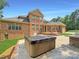 Relaxing hot tub on patio next to outdoor kitchen at 9100 Woodhall Lake Dr, Waxhaw, NC 28173