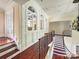 Upper landing overlooking the entryway with a unique architectural wall at 9100 Woodhall Lake Dr, Waxhaw, NC 28173