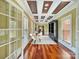 Bright office with hardwood floors and built-in shelving at 9100 Woodhall Lake Dr, Waxhaw, NC 28173