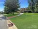 Brick home with a long driveway at 9100 Woodhall Lake Dr, Waxhaw, NC 28173