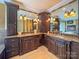 Bathroom with double vanities and corner cabinets at 9100 Woodhall Lake Dr, Waxhaw, NC 28173