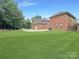 Spacious backyard with expansive green lawn and privacy fence at 9100 Woodhall Lake Dr, Waxhaw, NC 28173
